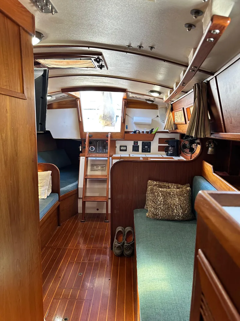 Slide: The Image of Interior of 1988 Cape Dory 30 MK II sailboat with wooden finishes and cozy seating. - 36