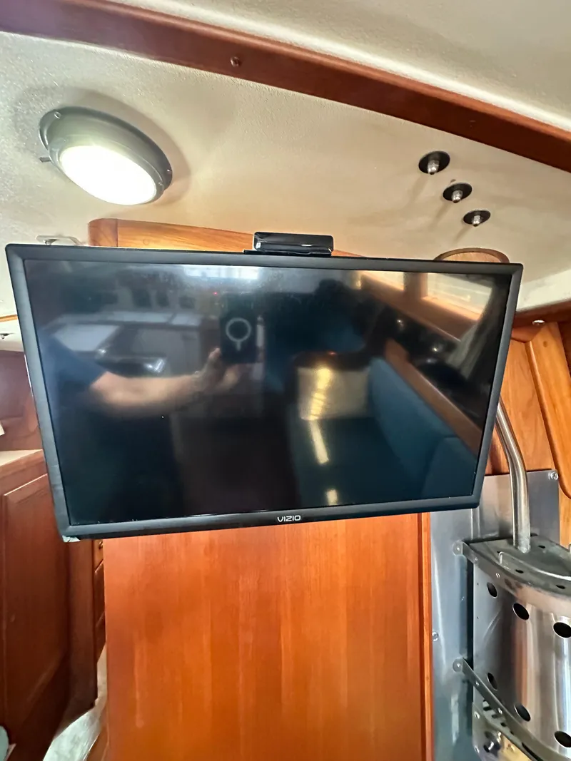 Slide: The Image of Flat-screen TV inside 1988 Cape Dory 30 MK II yacht cabin. - 38