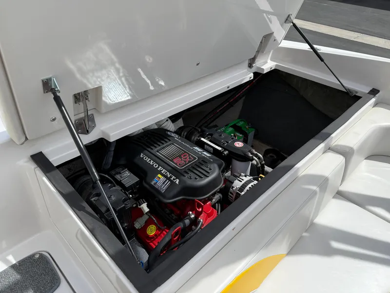 Slide: The Image of 2008 Reinell Bowrider 220LSE engine compartment with Volvo Penta engine visible. - 16