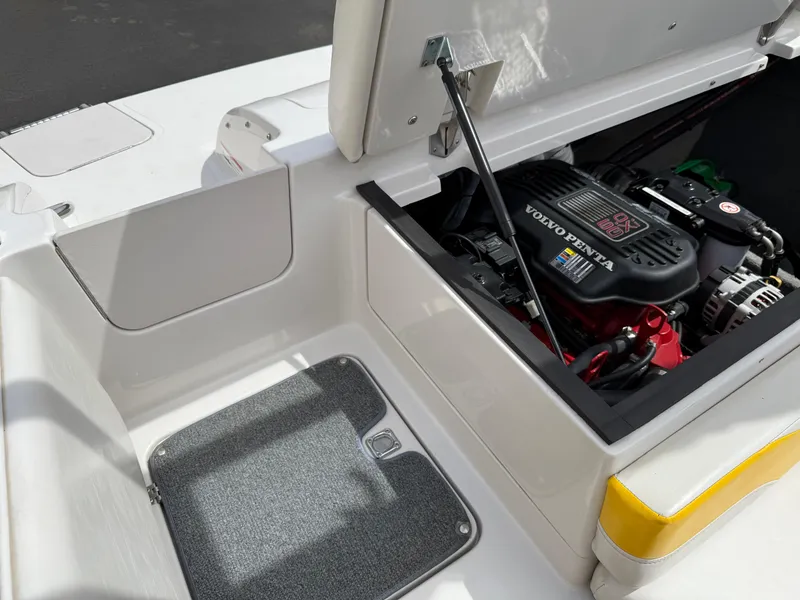 Slide: The Image of 2008 Reinell Bowrider 220LSE engine compartment with Volvo Penta engine visible. - 18