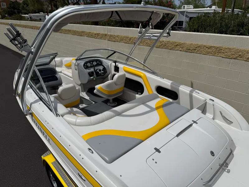 Slide: The Image of 2008 Reinell Bowrider 220LSE with yellow and gray interior, featuring a sleek design. - 19