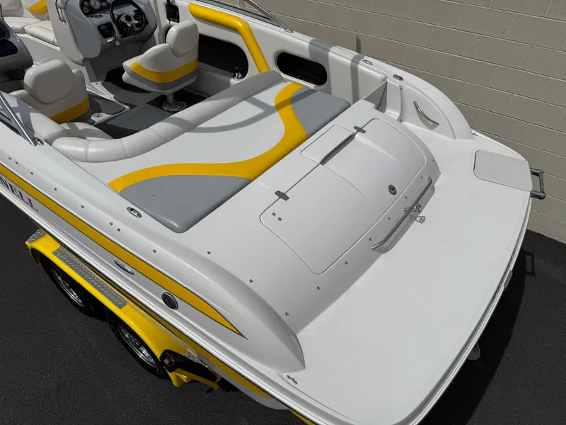 Slide: The Image of 2008 Reinell Bowrider 220LSE with yellow accents, featuring spacious seating and modern design. - 20