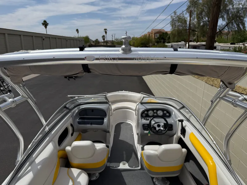 Slide: The Image of 2008 Reinell Bowrider 220LSE interior with yellow accents, steering wheel, and seating. - 23