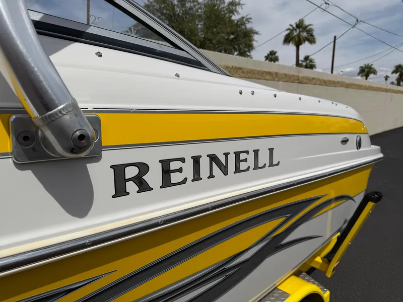 Slide: The Image of 2008 Reinell Bowrider 220LSE boat with yellow and white exterior design. - 3