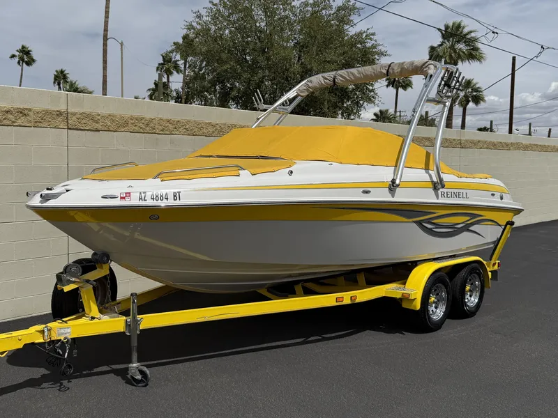 Slide: The Image of 2008 Reinell Bowrider 220LSE with yellow cover on a matching trailer. - 35
