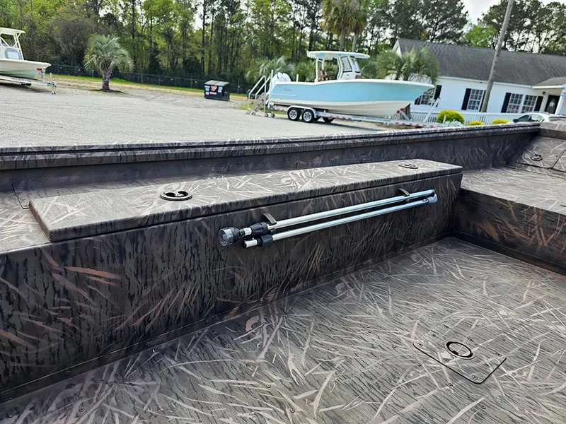 Slide: The Image of 2025 G3 Gator Tough 16 DK boat interior with camouflage pattern and rod holder. - 10
