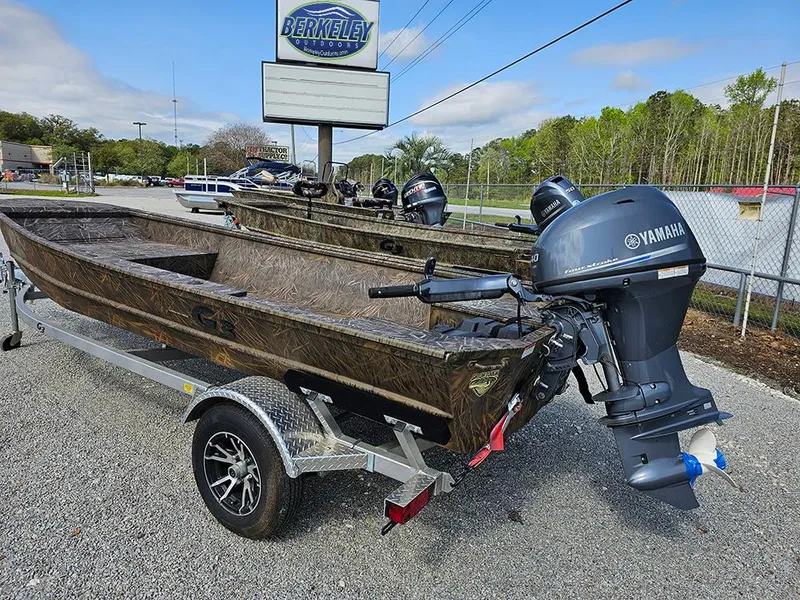 Slide: The Image of 2025 G3 Gator Tough 16 DK boat with Yamaha motor on a trailer, parked outdoors. - 2