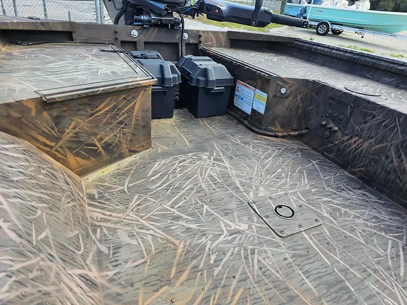 Slide: The Image of 2025 G3 Gator Tough 16 DK boat interior with camouflage design and storage compartments. - 8
