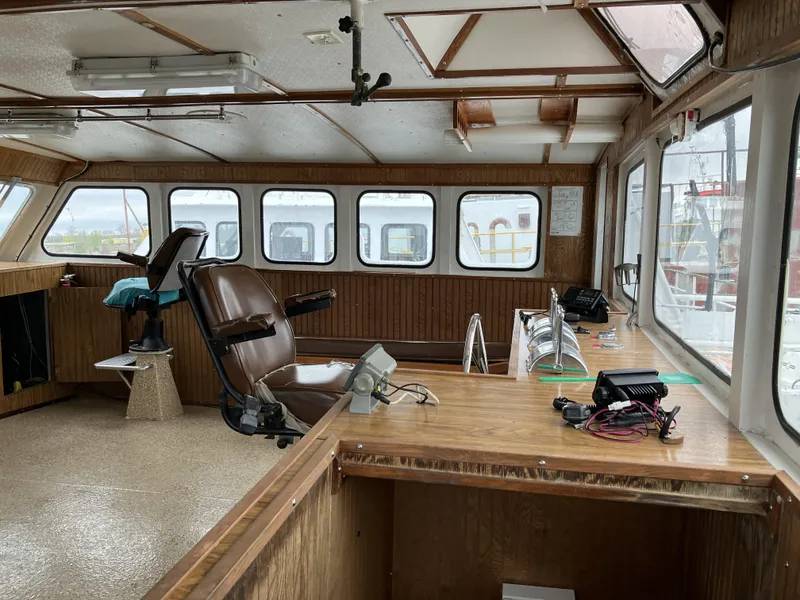 Slide: The Image of Interior of a 1994 commercial offshore crew boat with control station and seating. - 3