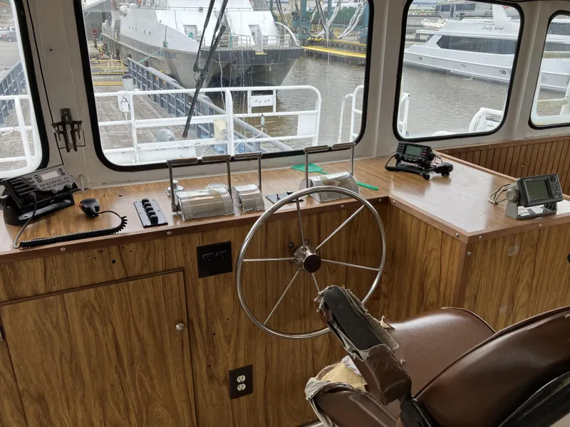 Slide: The Image of Interior of a 1994 commercial offshore crew boat cockpit with steering wheel and controls. - 5