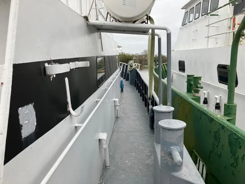 Slide: The Image of Offshore crew boat deck, 1994 model, showing walkway and railing details. - 7