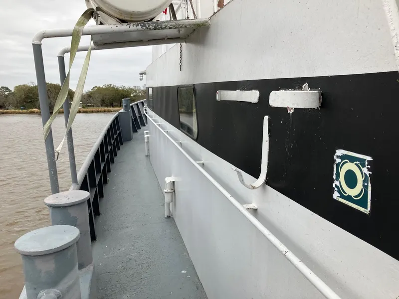 Slide: The Image of Side view of a 1994 Commercial Offshore Crew Boat on a river. - 8