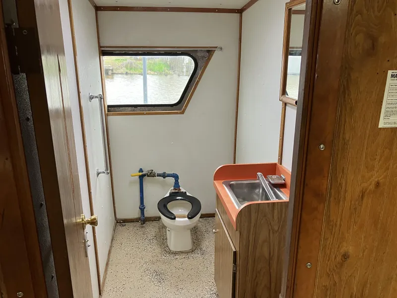 Slide: The Image of Bathroom interior of a 1994 Commercial Offshore Crew Boat with window and sink. - 9