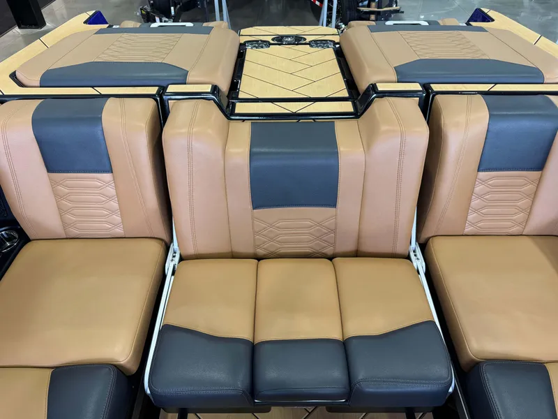 Slide: The Image of 2023 Malibu Wakesetter 26 LSV interior with tan and black leather seating. - 26