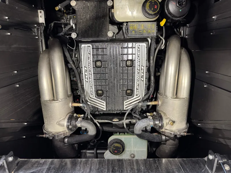 Slide: The Image of 2023 Malibu Wakesetter 26 LSV engine, showcasing supercharged components and detailed engineering. - 27