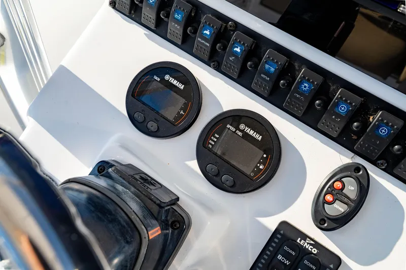 Slide: The Image of Control panel of 2018 Sea Hunt Triton 210 boat with Yamaha gauges and switches. - 16