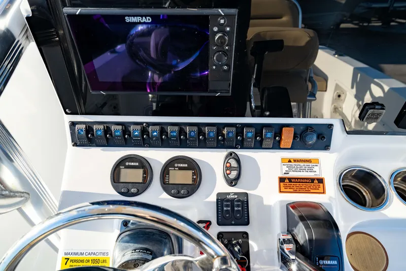Slide: The Image of Control panel of 2018 Sea Hunt Triton 210 boat with Simrad display and gauges. - 24