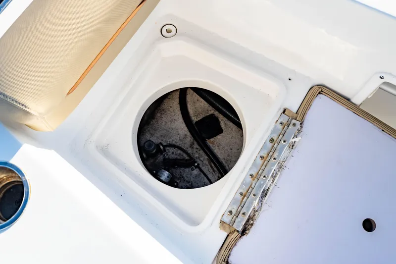 Slide: The Image of 2018 Sea Hunt Triton 210 boat storage compartment with open hatch. - 26
