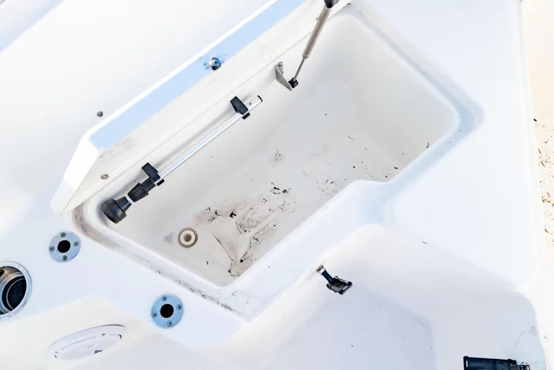 Slide: The Image of Open storage compartment on a 2018 Sea Hunt Triton 210 boat. - 29