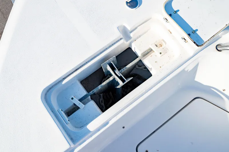 Slide: The Image of Anchor storage compartment on 2018 Sea Hunt Triton 210 boat deck. - 31