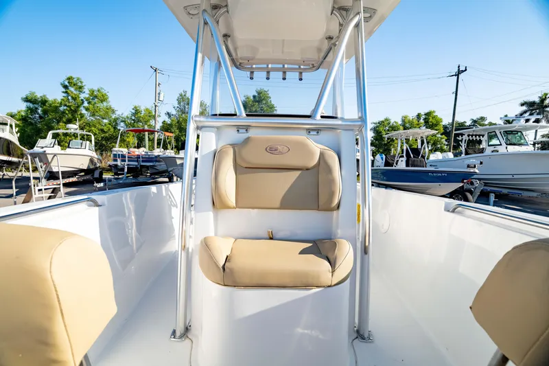Slide: The Image of 2018 Sea Hunt Triton 210 boat interior with beige seating and console. - 34