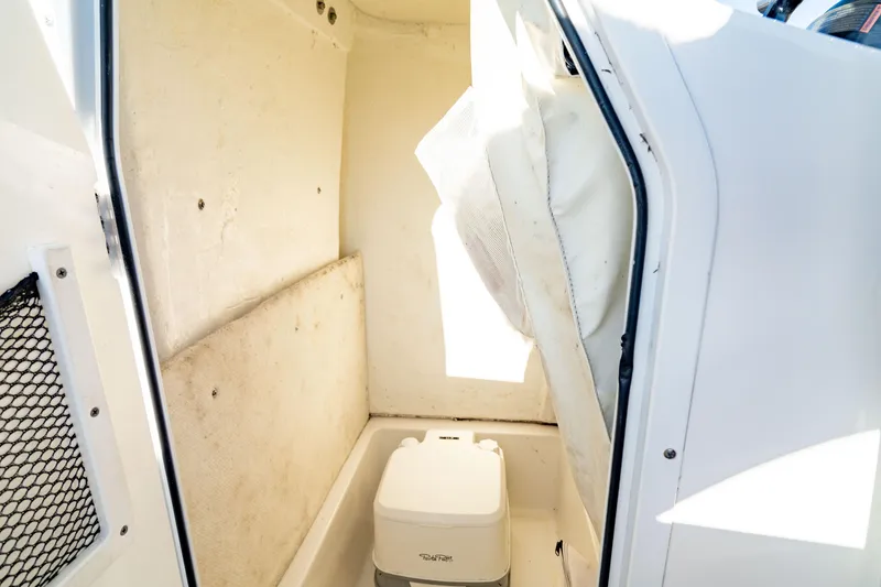 Slide: The Image of Interior of 2018 Sea Hunt Triton 210 boat with portable toilet. - 35