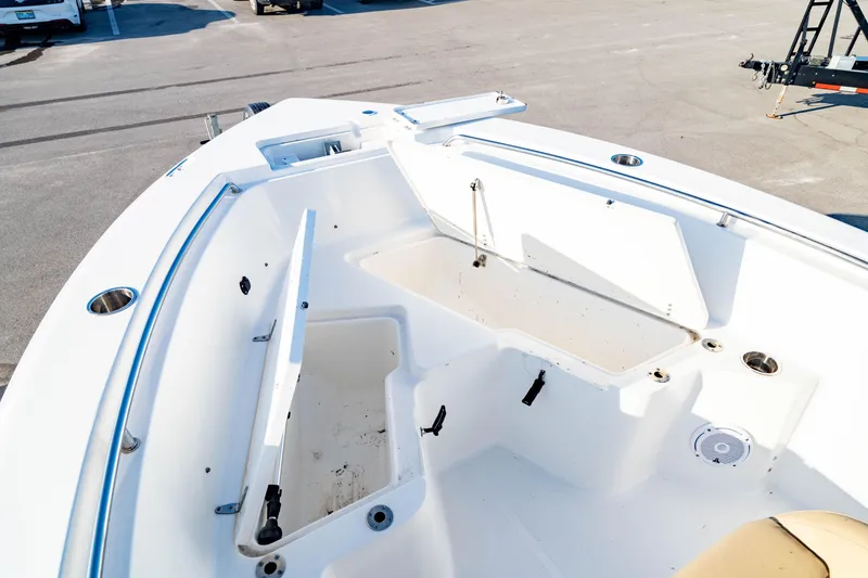 Slide: The Image of 2018 Sea Hunt Triton 210 boat interior with open storage compartments. - 5