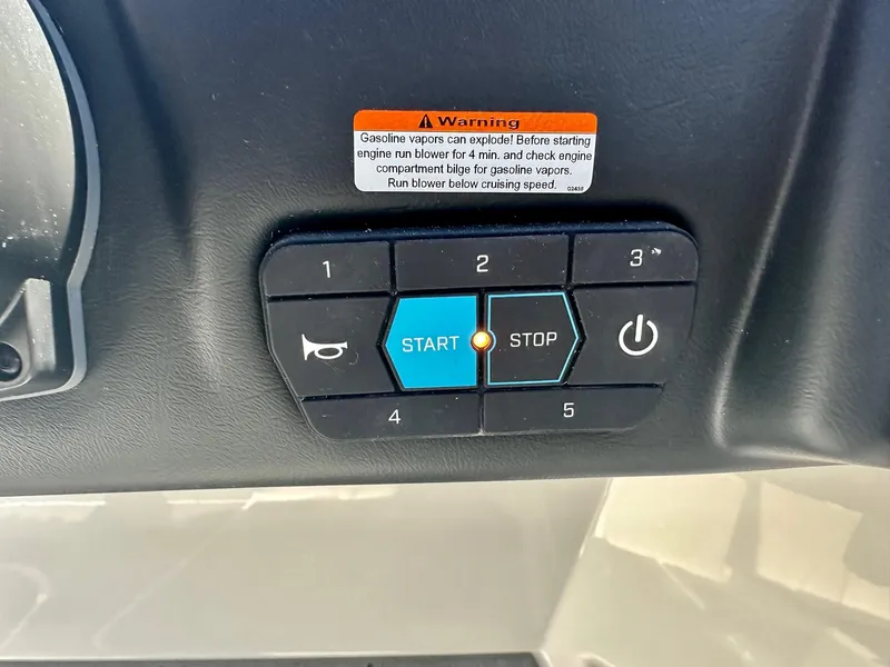 Slide: The Image of 2024 ATX Surf Boats 20 Type-S control panel with start and stop buttons. - 13