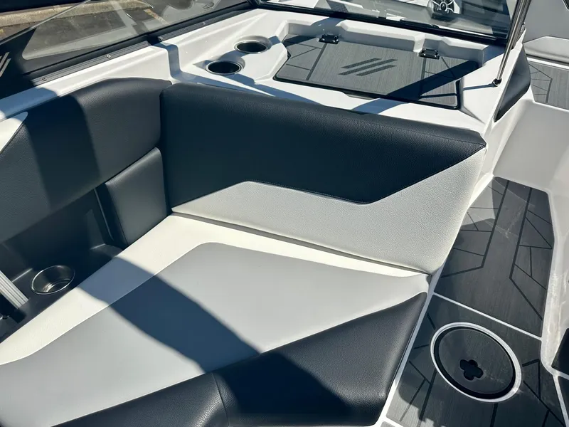 Slide: The Image of 2024 ATX Surf Boats 20 Type-S interior seating with modern design and cup holders. - 16
