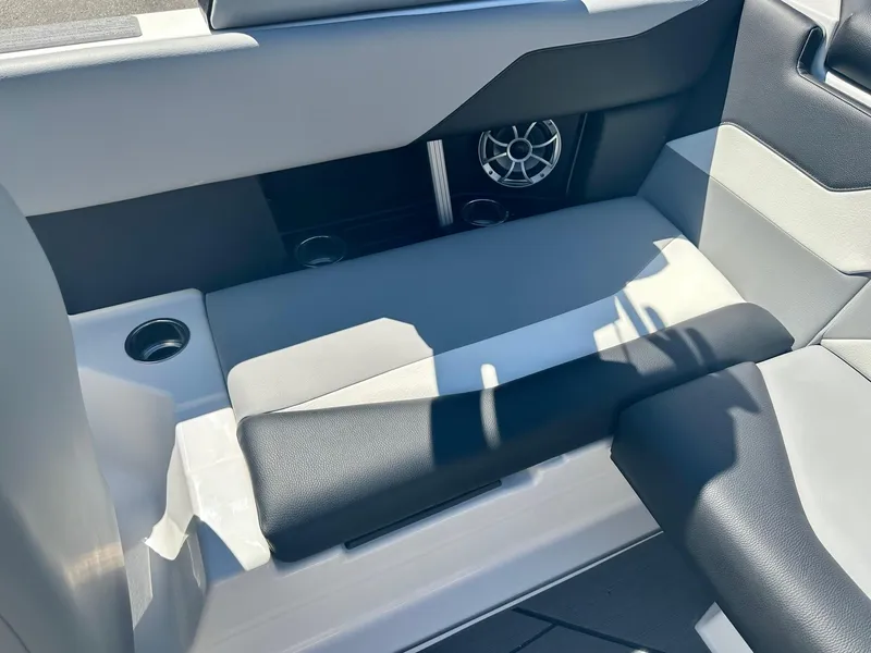 Slide: The Image of 2024 ATX Surf Boats 20 Type-S interior seating with speaker and cup holder. - 20