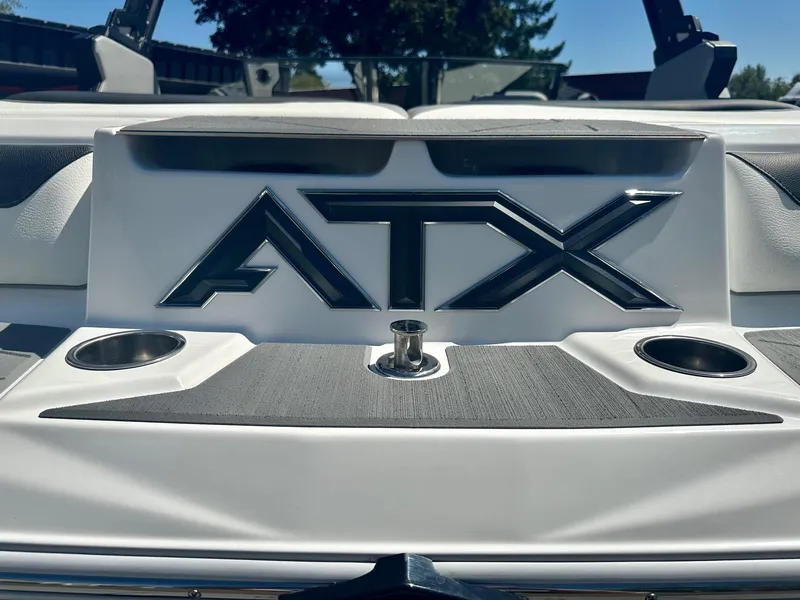 Slide: The Image of 2024 ATX Surf Boats 20 Type-S rear view with logo and cup holders. - 25