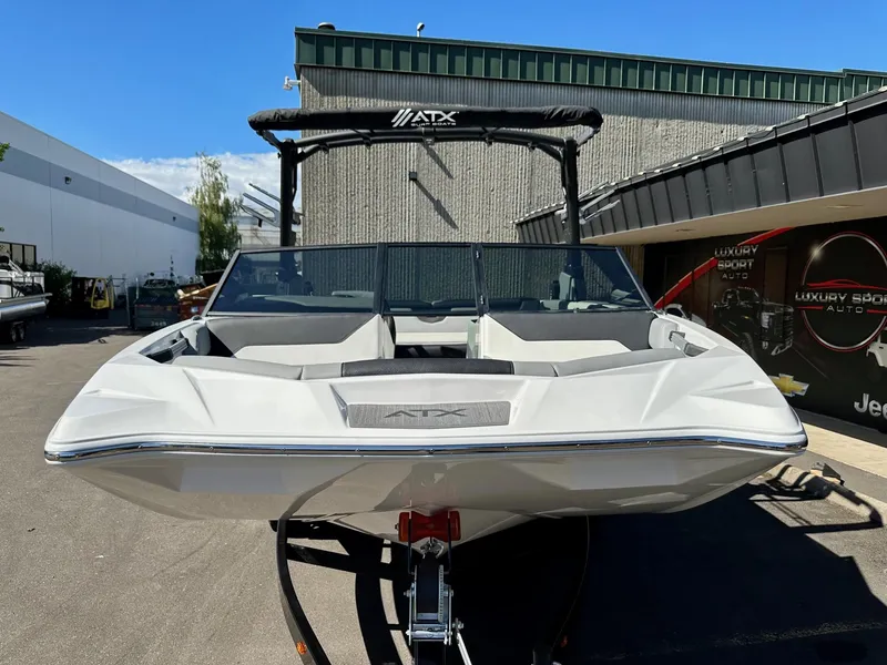 Slide: The Image of 2024 ATX Surf Boats 20 Type-S, sleek design, parked outdoors, front view. - 29