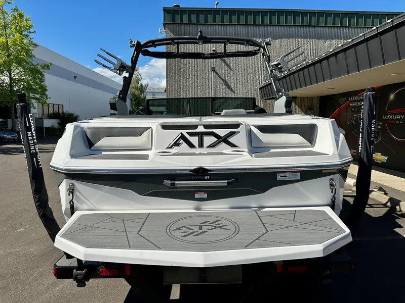 Slide: The Image of 2024 ATX Surf Boats 20 Type-S, rear view, parked outdoors. - 30