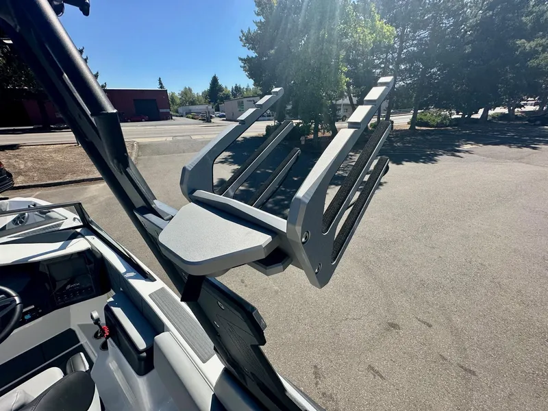 Slide: The Image of 2024 ATX Surf Boats 20 Type-S wakeboard rack in sunlight, showcasing sleek design. - 32