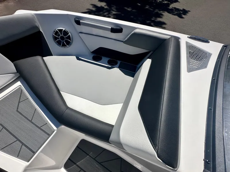 Slide: The Image of 2024 ATX Surf Boats 20 Type-S interior with sleek seating and modern speaker system. - 6