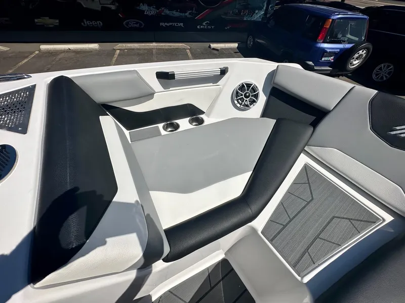 Slide: The Image of 2024 ATX Surf Boats 20 Type-S interior with sleek seating and modern speaker system. - 8
