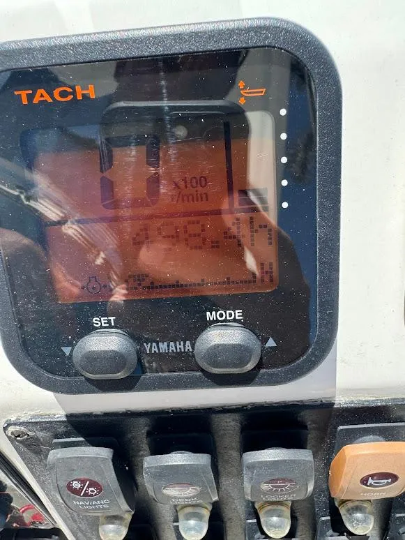 Slide: The Image of Close-up of Yamaha tachometer on 2009 Edgewater 245 CX boat dashboard. - 26