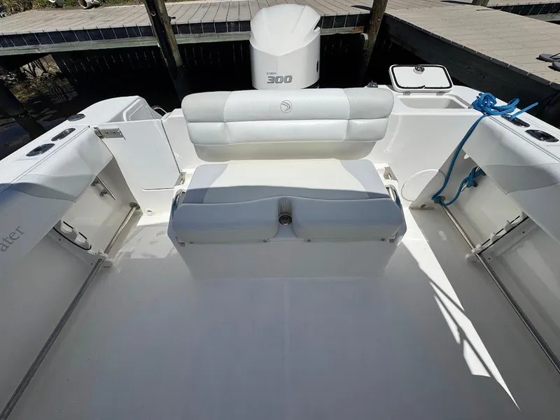 Slide: The Image of Edgewater 245 CX 2009 boat interior with seating and outboard motor. - 28