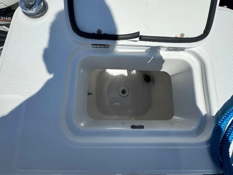 Slide: The Image of Open storage compartment on 2009 Edgewater 245 CX boat deck. - 33