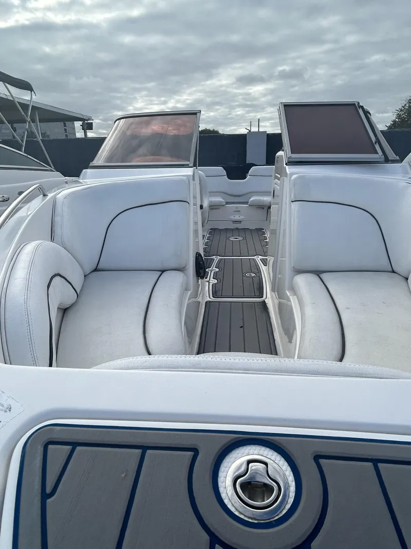 Slide: The Image of 2007 Yamaha Boats SR-230 interior with white seating and open deck. - 2