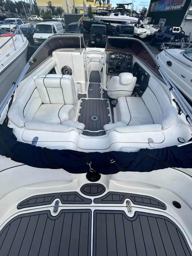 Slide: The Image of 2007 Yamaha Boats SR-230 interior with white seating and modern dashboard. - 4