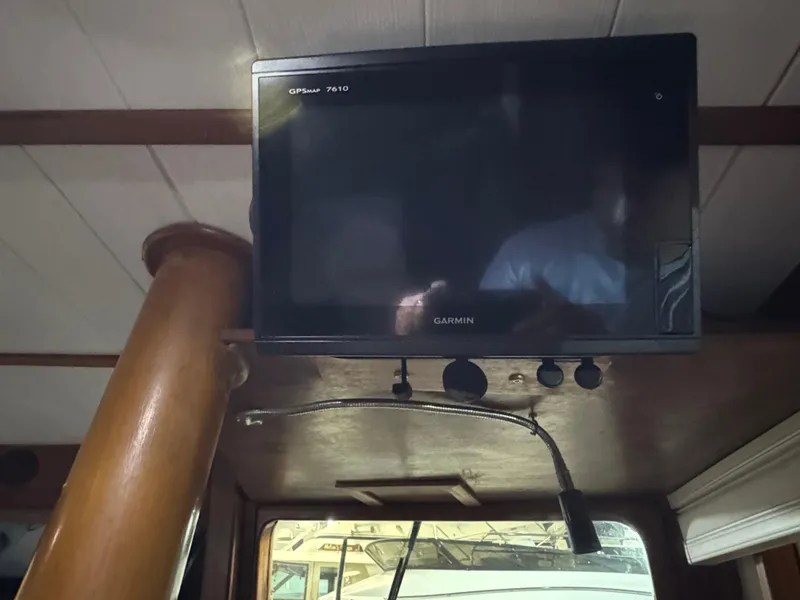 Slide: The Image of Garmin GPS screen inside 1983 Marine Trader 44 Sundeck boat cabin. - 12