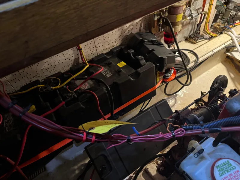 Slide: The Image of Engine room of 1983 Marine Trader 44 Sundeck with visible wiring and components. - 28