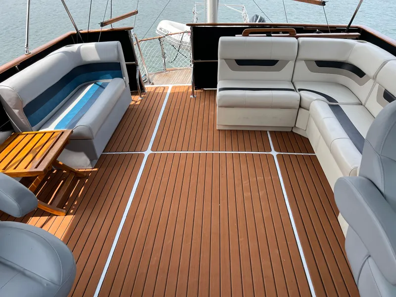 Slide: The Image of 1983 Marine Trader 44 Sundeck with spacious seating and wooden deck. - 5