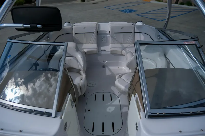 Slide: The Image of Interior of 2010 Four Winns 220H boat with seating and windshield. - 12