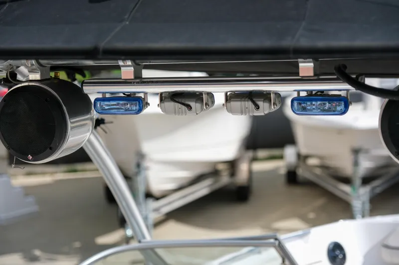 Slide: The Image of 2010 Four Winns 220H boat with speakers and lights on a metal frame. - 20