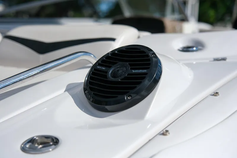 Slide: The Image of Close-up of a 2010 Four Winns 220H boat speaker and railing. - 21