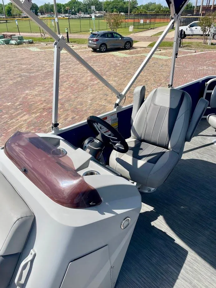 Slide: The Image of 2022 Bennington SX 23 Fishing boat interior with steering console and seating. - 12
