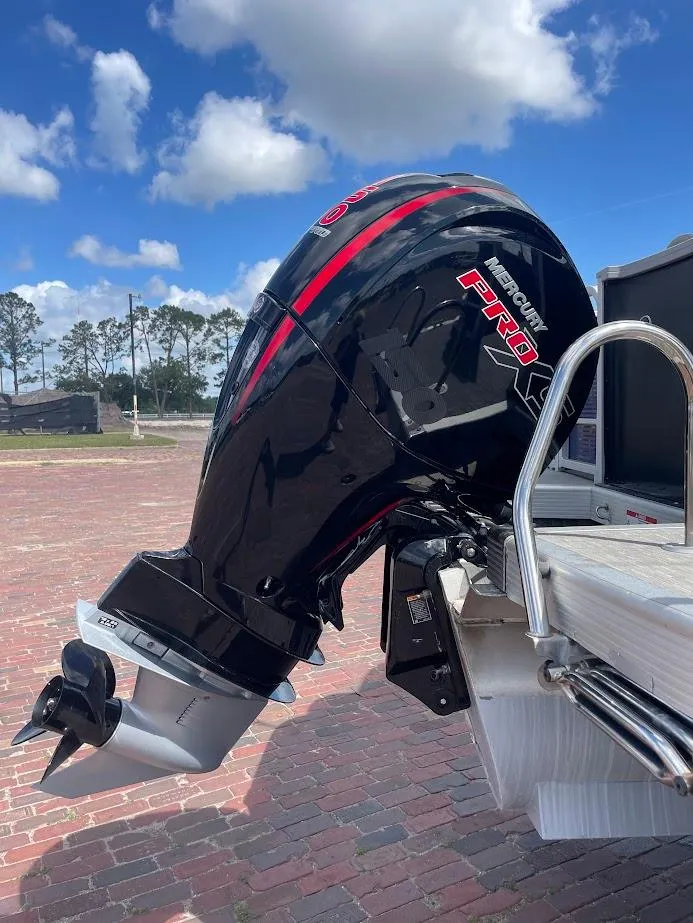 Slide: The Image of 2022 Bennington SX 23 Fishing boat with powerful outboard motor on a sunny day. - 3