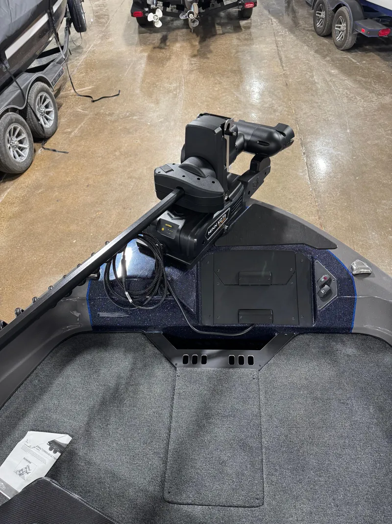 Slide: The Image of 2025 Skeeter WXR 2260 F boat with advanced trolling motor in showroom. - 13